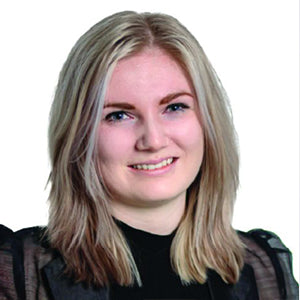 Person with shoulder-length blonde hair wearing a black top